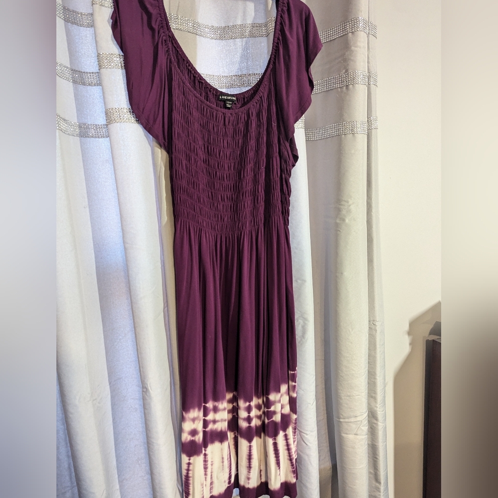 Comfortable Cool Purple Dress With The Detail Around Bottom.